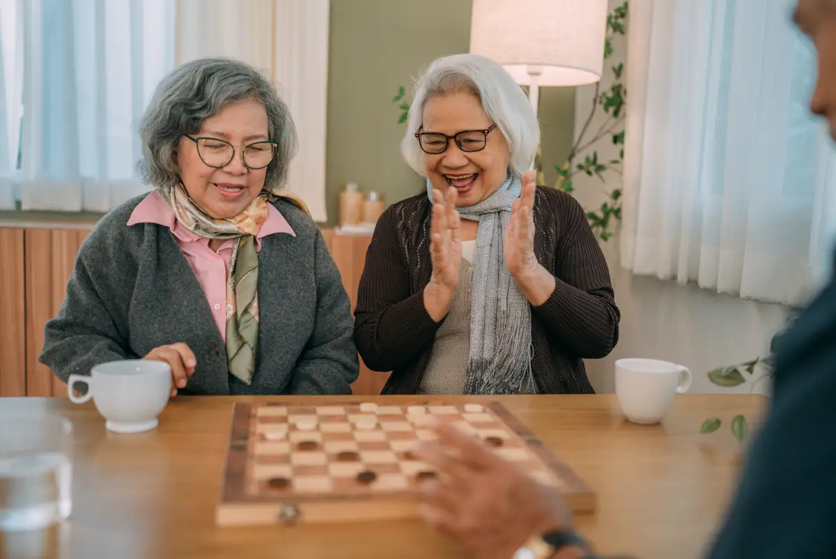 senior women playing checkers